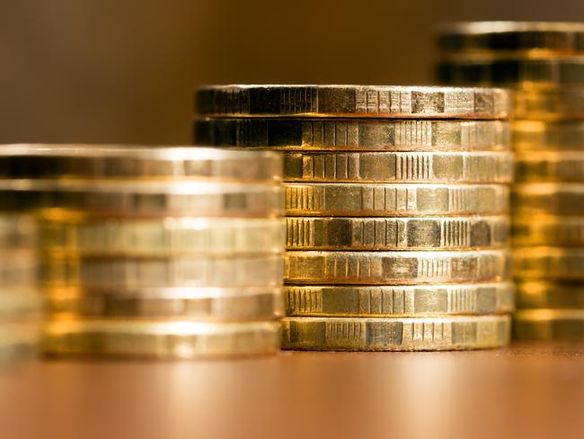 Stacks of gold coins of varying heights, Australian money generic