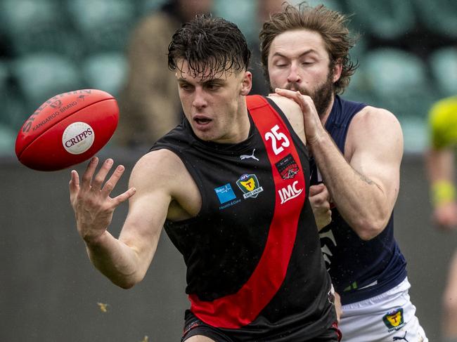 TSL: TSL Grand Final 2020, North Launceston vs. Launceston, UTAS Stadium: North Launceston's Jackson Callow tries to fend off Launceston's Jake Smith. Picture: LUKE BOWDEN