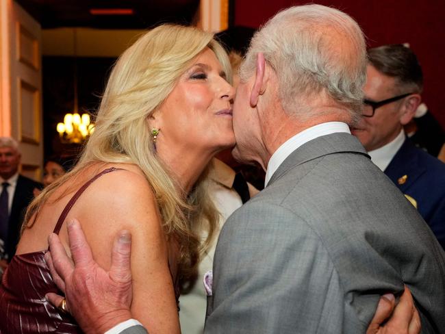 King Charles III embraces Penny Lancaster during the inaugural awards at St James' Palace, in central London. Picture: AFP