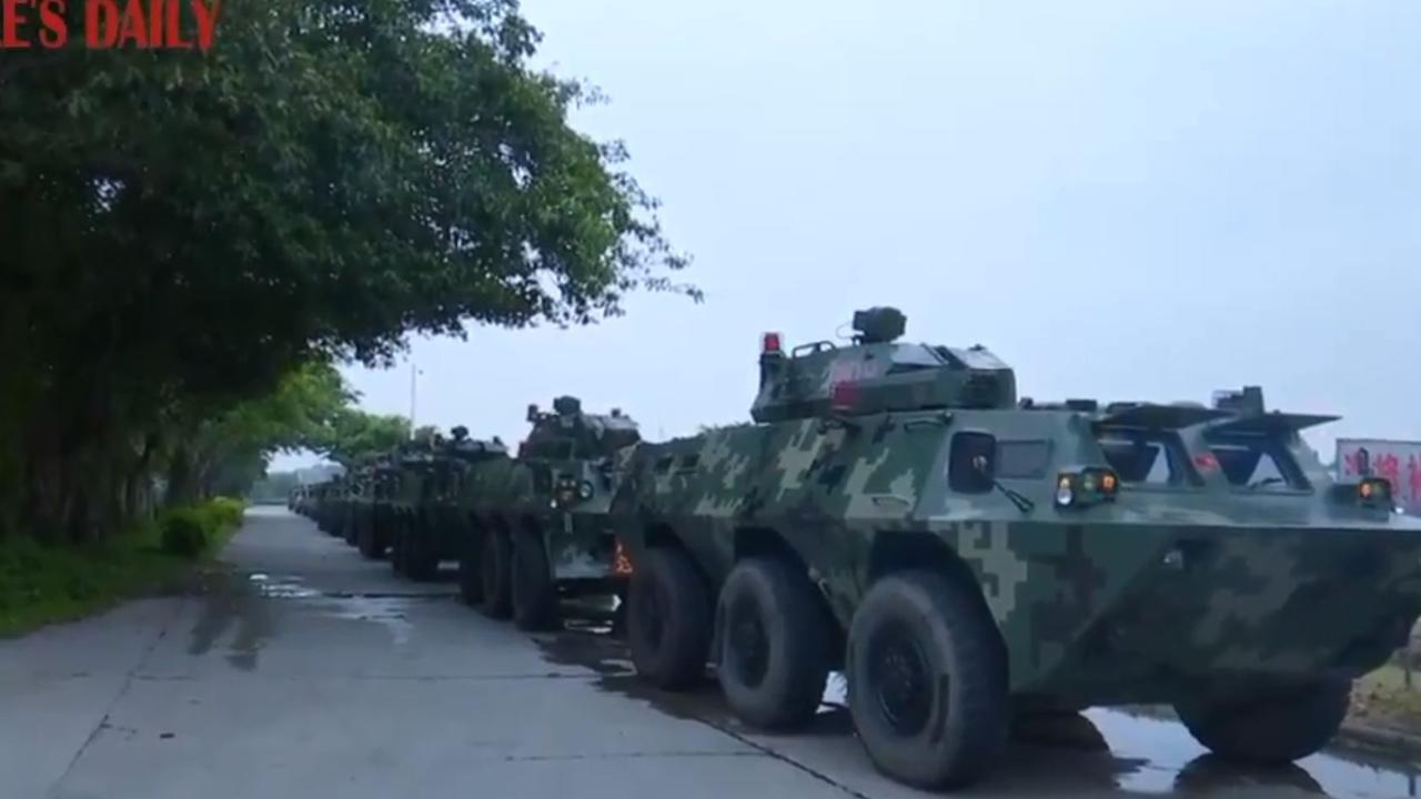 China’s state media has published footage of military vehicles purportedly heading towards the southern border with Hong Kong.