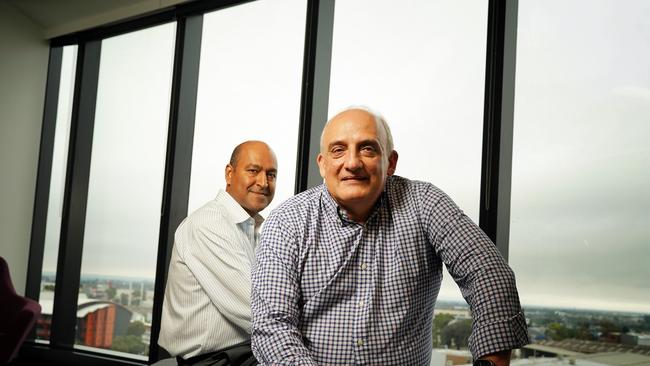 Sigma Healthcare chief executive Vikesh Ramsunder, back, with Chemist Warehouse co-founder Mario Verrocchi have inked a landmark deal to take the pharma outlet chain public. Picture: Luis Enrique Ascui