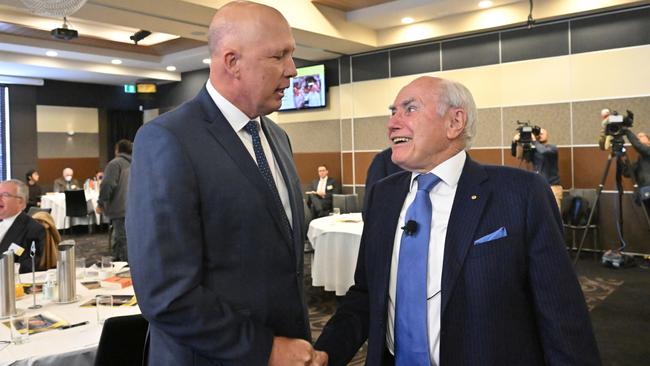 Leader of the Opposition Peter Dutton and former prime minister John Howard during the launch of 'The Art of Coalition' book at the National Press Club in Canberra on June 23, 2022. (AAP Image/Mick Tsikas)