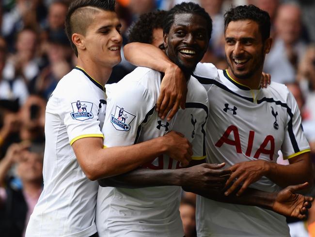 LONDON, ENGLAND - AUGUST 24: Emmanuel Adebayor of Spurs celebrates his goal with team mates during the Barclays Premier League match between Tottenham Hotspur and Queens Park Rangers at White Hart Lane on August 24, 2014 in London, England. (Photo by Jamie McDonald/Getty Images)