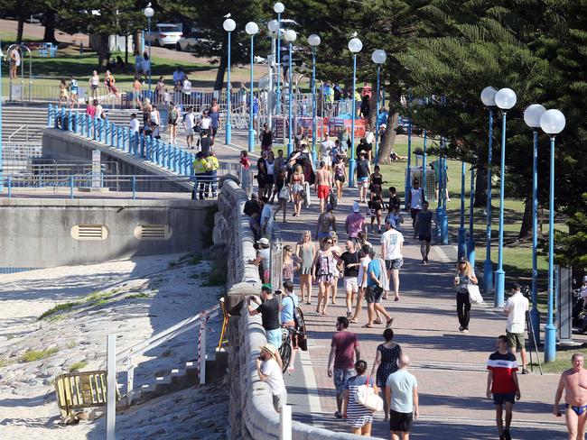 Police and lifeguards closed Coogee beach on Friday after crowds flocked for the sun and surf. Picture: Matrix