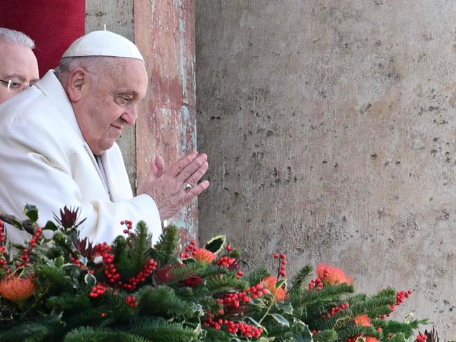 Pope Francis greets the crowd from the main balcony of St. Peter's basilica after the Urbi et Orbi message and blessing to the city and the world as part of Christmas celebrations, at St Peter's square in the Vatican on December 25, 2024. Picture: AFP