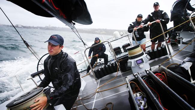 Sailing master Iain Murray and his crew take Andoo Comanche for some last-minute testing on Sydney Harbour before the start of the Sydney Hobart on Tuesday. Picture: John Feder