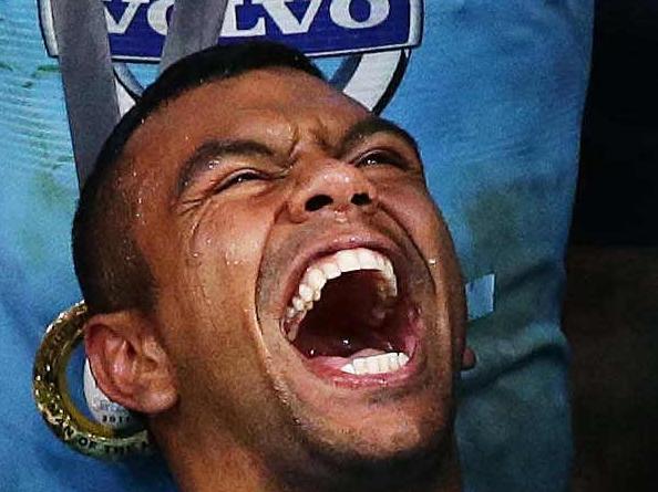 Brett Costello 2014 Walkley Award finalist pictures. 5. Kurtley Beale of the NSW Waratahs Super Rugby team celebrates with his teammates after winning the 2014 Super Rugby Final against the Crusaders at ANZ Stadium, Sydney. 2-8-14