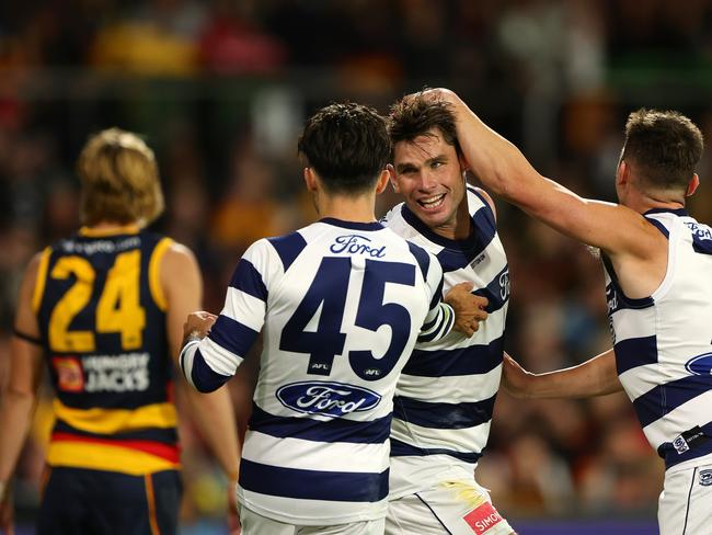 ADELAIDE, AUSTRALIA - MARCH 22: Tom Hawkins of the Cats celebrates a goal with Brad Close and Shaun Mannagh during the 2024 AFL Round 2 match between the Adelaide Crows and the Geelong Cats at Adelaide Oval on March 22, 2024 in Adelaide, Australia. (Photo by Sarah Reed/AFL Photos via Getty Images)