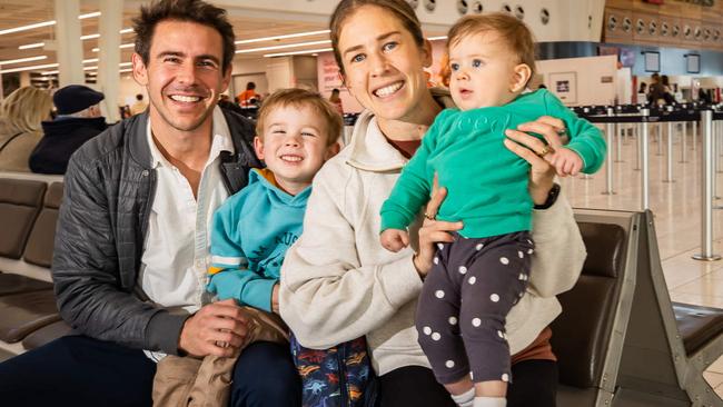 Jessica and Dylan Stenson with kids Billy, 4, Ellie, 9, months, at Adelaide Airport heading to Paris via Gold coast for a half marathon, pictured on July 7th, 2024.Picture: Tom Huntley