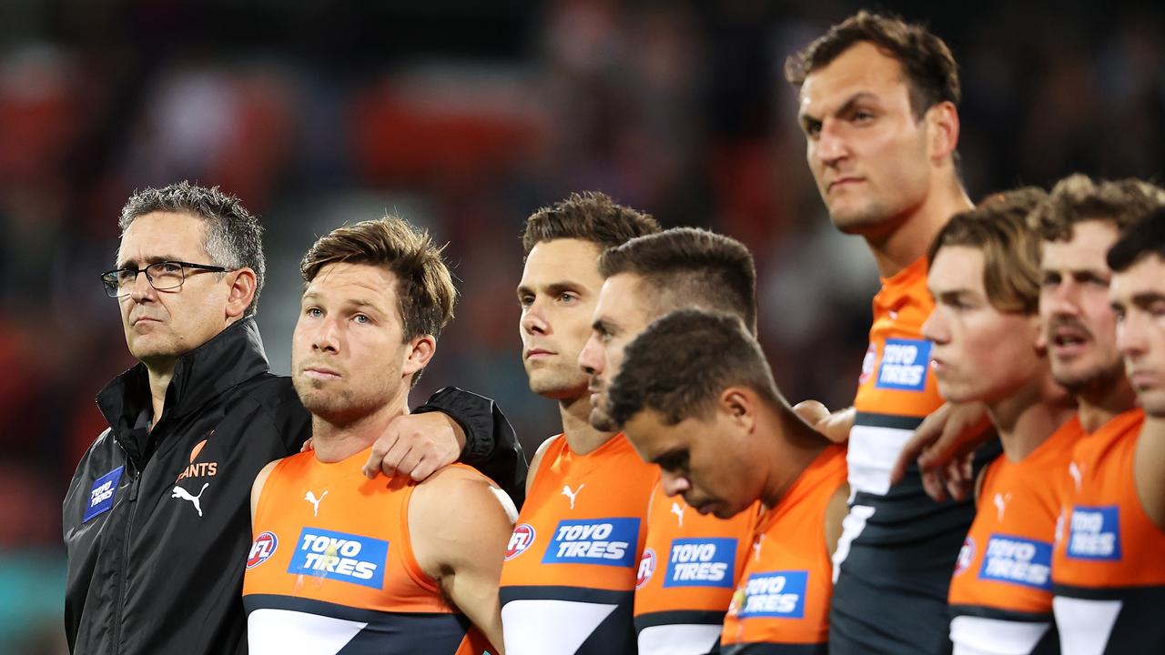 Giants coach Leon Cameron stands with his team during the pre-match ANZAC ceremony. Photo by Mark Kolbe/Getty Images.