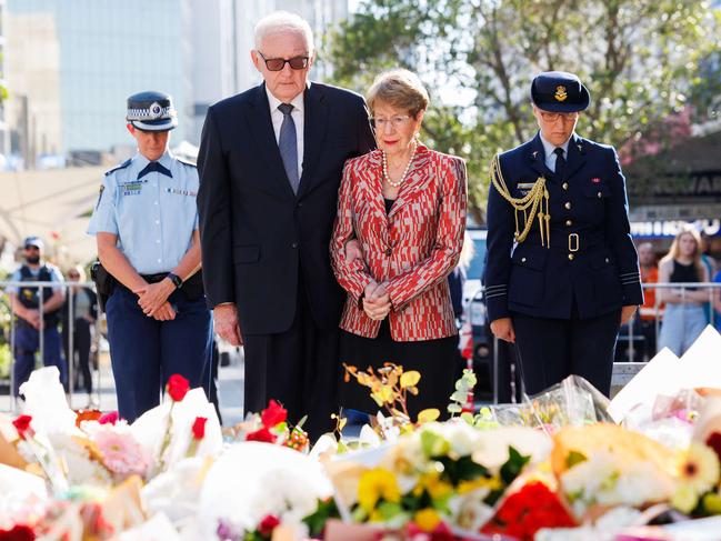 NSW Governor Margaret Beazley and her husband pay a floral tribute. Picture: David Swift/NCA Newswire