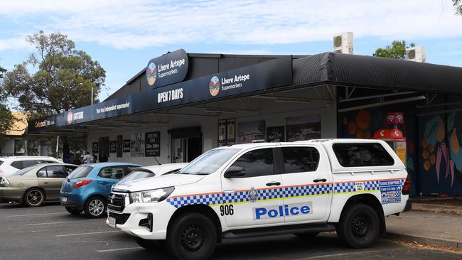 Police presence at the 3pm opening of the Lhere Artepe IGA bottle shop in Alice Springs in 2023. Picture Mark Brake