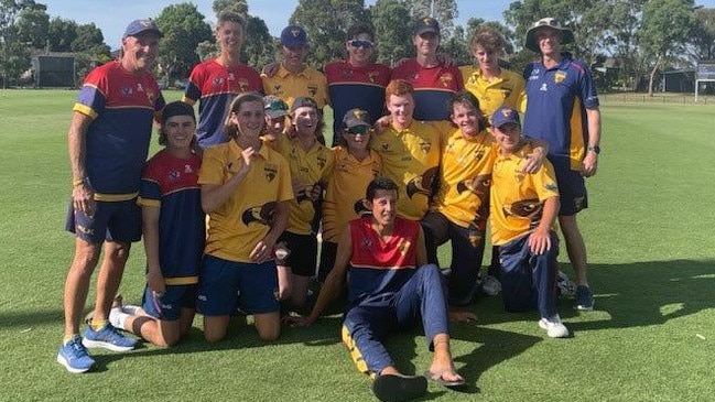 Tyler Pearson, sitting on ground, with the Hawks' Dowling Shield side last season.