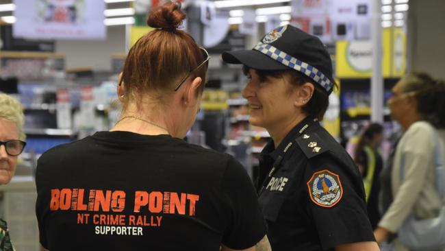 Dozens of shoppers stopped to chat to Territory police at the Karama ‘Coffee with a Cop’ session on Friday, including one wearing an NT crime rally shirt. Picture: Annabel Bowles