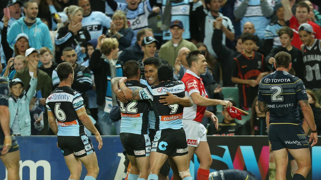 Sharks fans celebrate a try.