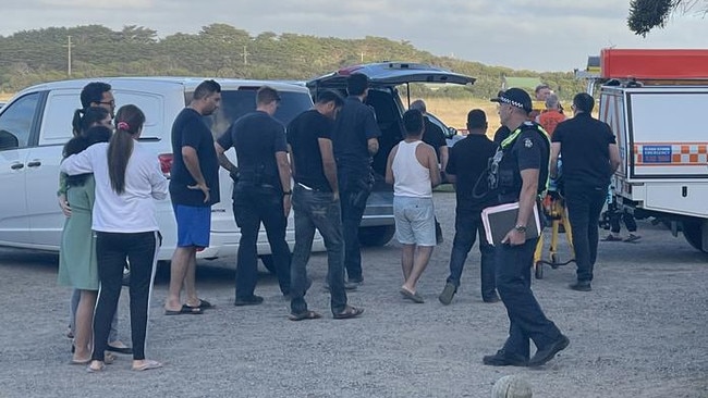 Family members are comforted after three people drown at Phillip Island. Picture: Jack Colantuono/ Herald Sun