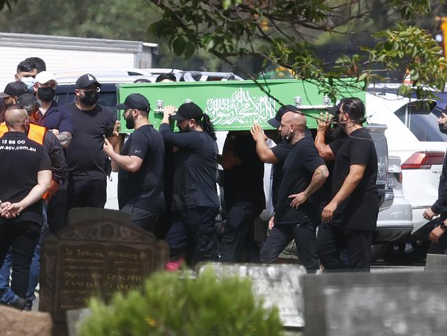 2 Pictured at Rookwood Cemetery in Sydney are mourners at the funeral for Ghassan Amoun who was shot dead in Wentworthville.