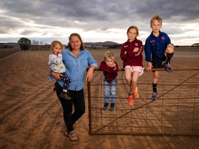 Katherine Myers and her children Charlotte, Tommy, Angus, and John on their drought-stricken farm. Picture: Mark Stewart