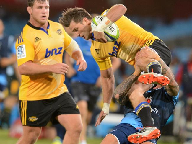 Francois Hougaard of the Bulls competes with Cory Jane of the Hurricanes.