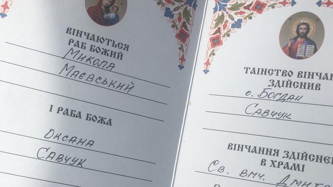 The pair signed their marriage certificate a fortnight after Russian tanks entered Ukraine. Picture: Supplied