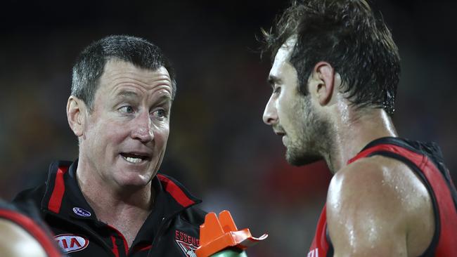 John Worsfold talks to a weary Jobe Watson. Picture: Sarah Reed