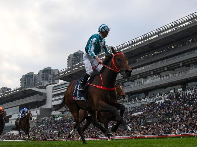 HONG KONG, CHINA - DECEMBER 08: James McDonald riding Romantic Warrior winning Race 8, the Longines Hong Kong Cup during racing at Sha Tin Racecourse on December 08, 2024 in Hong Kong, China.  (Photo by Vince Caligiuri/Getty Images)