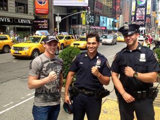 Daniel Geale with NYPD officers in Times Square.