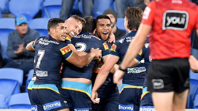 The Titans celebrate victory against the Warriors at Cbus Super Stadium on Friday night. Picture: Getty Images