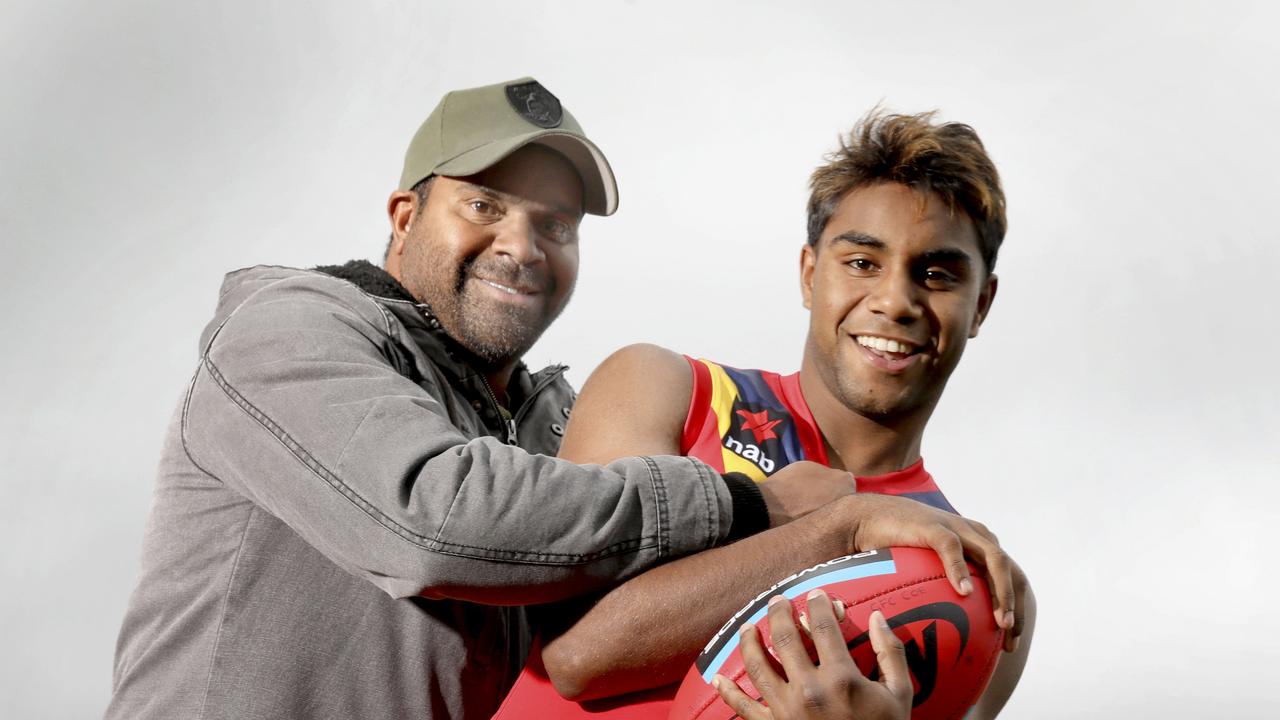 Kysaiah Pickett with his uncle Byron Pickett, who won the 2004 Norm Smith Medal.