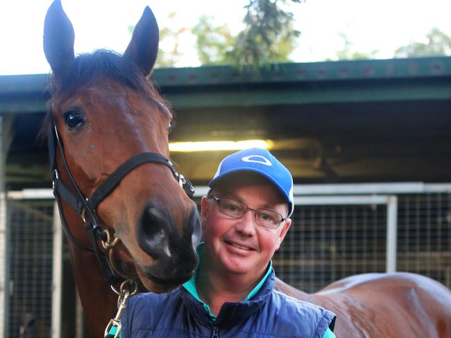 NZ trainer Tony Pike with Rangipo. Track work at Doomben. Pics Tim Marsden