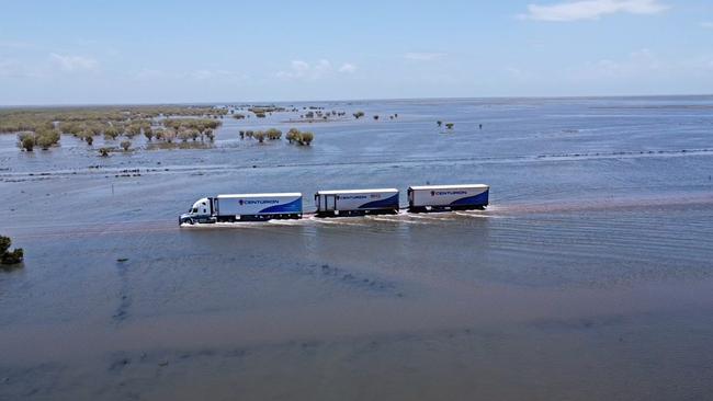 A road train drives through flood waters in Roebuck Plains in the Kimberley region in January this year. Picture: Eddy Dolic - Centurion Transport