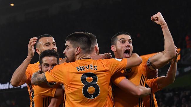 Wolverhampton Wanderers' Irish defender Matt Doherty celebrates with teammates after he scores his team's third goal. Picture: AFP/