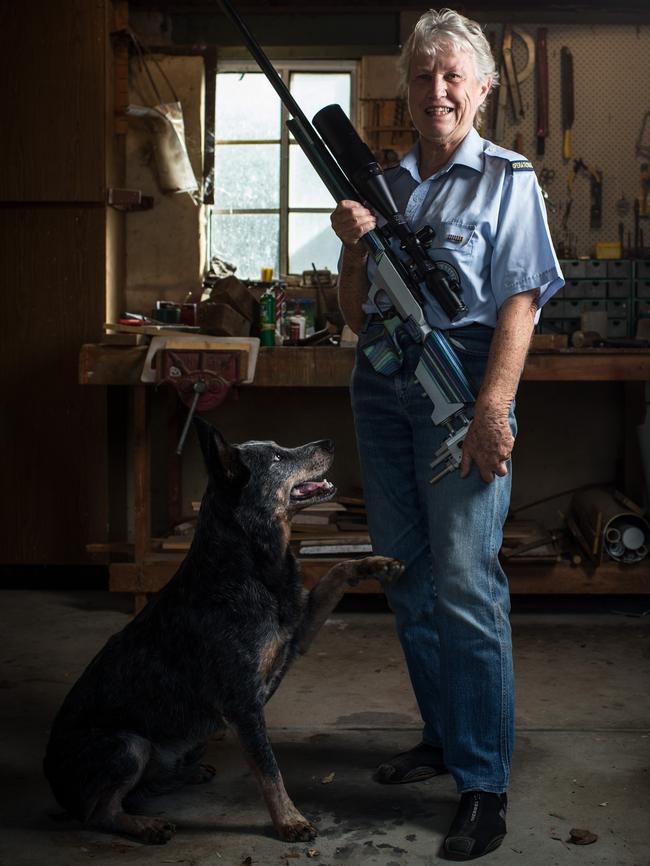 Yvonne Hill with her rifle and dog Blaze at her Paralowie home. Picture: Matt Turner