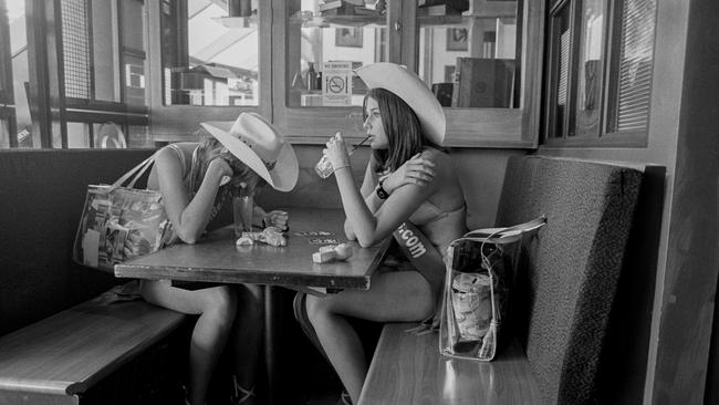 Meter Maids, Hannah Pallister, 15, (left) and Jessica Stunden, 18, on a lunch break from their six-hour shift in stilettos. Picture: Fiona Morris