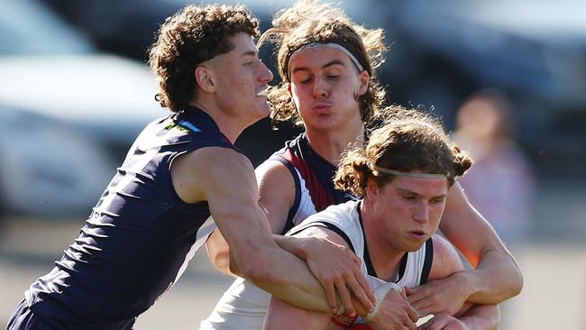 Geelong player Patrick Hughes is met by some tough Dragons defence. Pic: Getty.