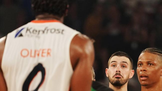 Chris Goulding of United makes fun of Cameron Oliver of the Taipans during a scuffle during the Round 20 NBL match between the Melbourne United and the Cairns Taipans at Melbourne Arena in Melbourne, Thursday, February 13, 2020. (AAP Image/Michael Dodge)