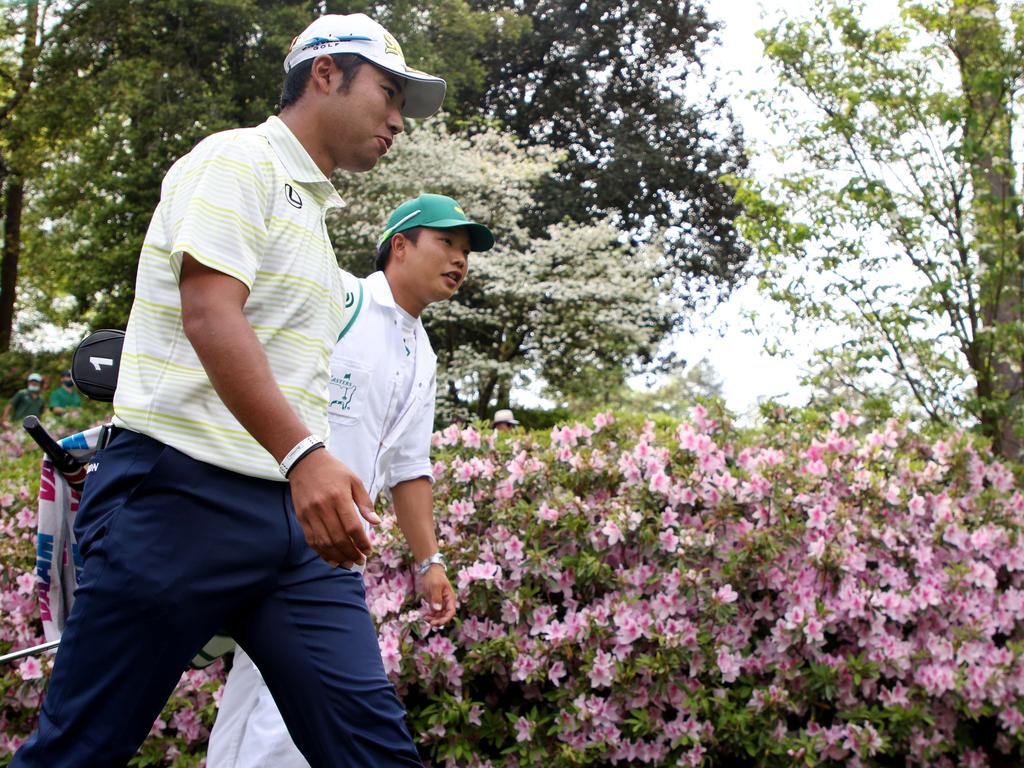 Hideki Matsuyama walks with his caddie, Shota Hayafuji. Picture: Kevin C. Cox/Getty Images