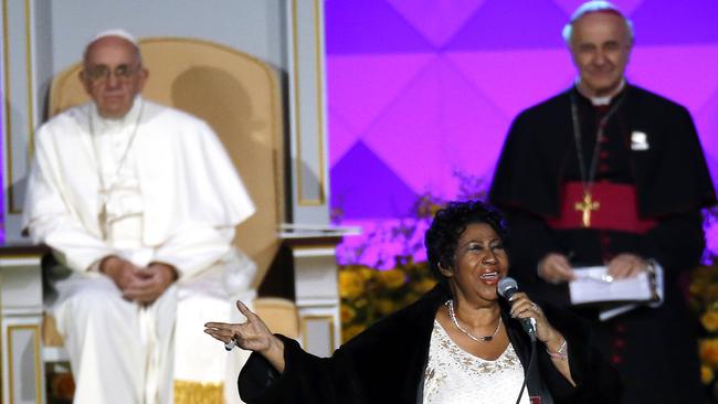 Aretha Franklin performs as Pope Francis is seated left, looks on during the Festival of Families in Philadelphia in 2015.