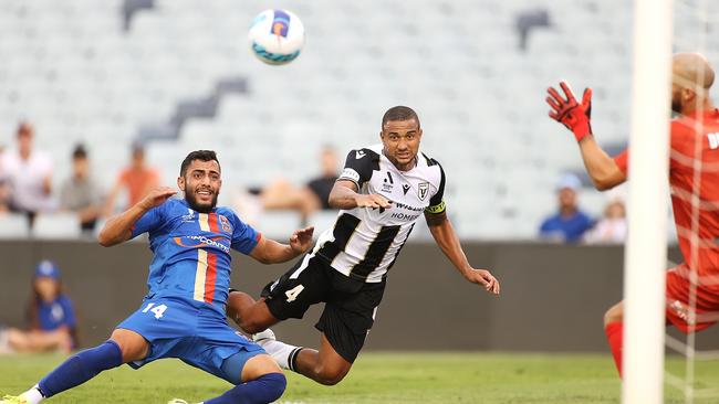 James Meredith of the Bulls (right) scores a goal from header under pressure in the A-League mens match between Macarthur FC and Newcastle Jets. (Photo by Mark Kolbe/Getty Images)