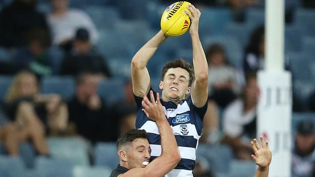 Jordan Clark rises above a pack to mark for Geelong. Picture: Michael Klein. 