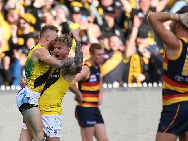 Nathan Broad celebrates the Tigers’ premiership-winning moment.