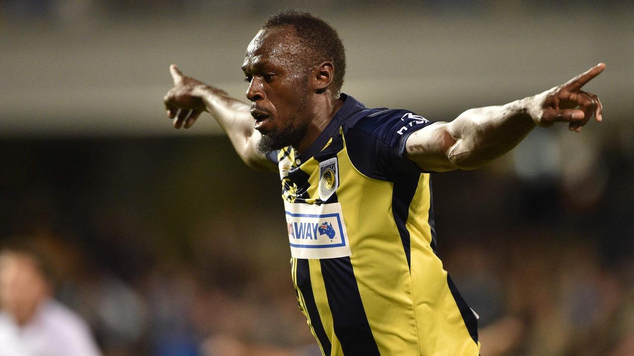 TOPSHOT - Olympic sprinter Usain Bolt celebrates scoring a goal for A-League football club Central Coast Mariners