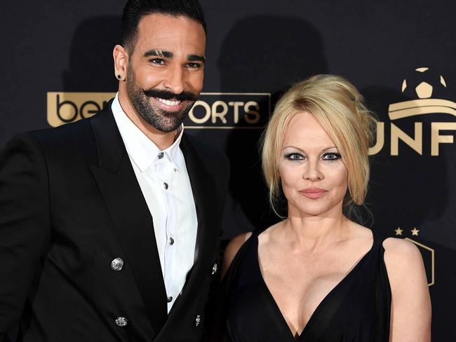 (FILES) In this file photo taken on May 19, 2019 Marseille's defender Adil Rami (L) and US actress Pamela Anderson arrive to take part in a TV show in Paris, as part of the 28th edition of the UNFP (French National Professional Football players Union) trophy ceremony. - US actress Pamela Anderson announced on June 25, 2019 to have split up with Marseille's defender Adil Rami. (Photo by FRANCK FIFE / AFP)