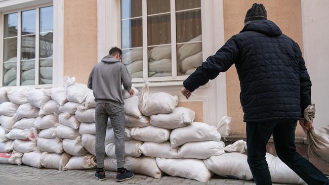 People placing sandbags in Ivano-Frankivsk in the southwest of Ukraine, where Russia launched air strikes overnight. Picture: Getty Images.