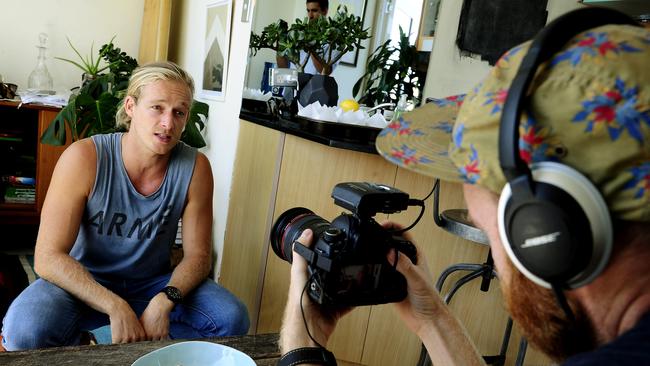 Guy Turland filming scenes for Bondi Harvest’s YouTube channel in Guy's Bondi Beach apartment. Picture: John Appleyard