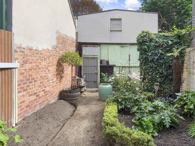 The backyard, with toilet at the rear.