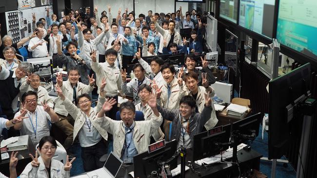 Mission control celebrates the success of Hayabusa2's touchdown. Picture: AFP