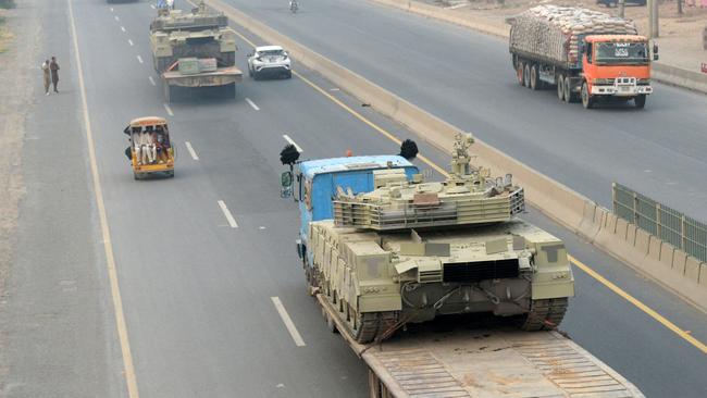 Trucks transport army tanks on a road in Muridke, about 30km from Lahore. Picture: AFP