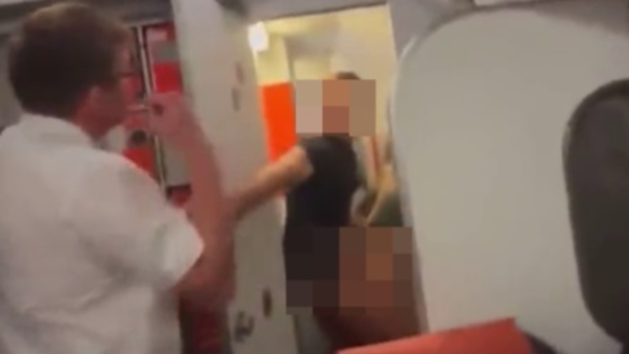 A steward was filmed catching Piers Sawyer and the girl in the act, with passengers cheering as the toilet door swung open. Picture: X, formerly Twitter