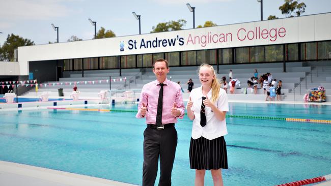 St Andrew's Anglican College Principal Chris Ivey and star swimming student Lauren Maguire at the opening their new aquatic centre in 2019.